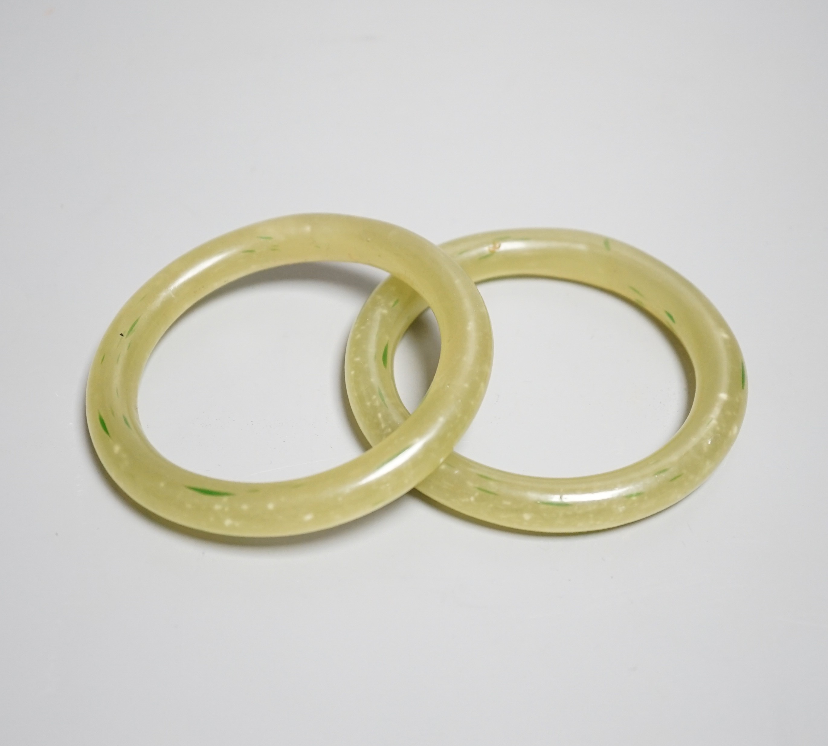 Two Chinese bowenite jade bangles, 9.2cm